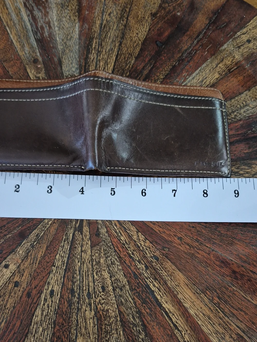 Fossil Brown and Tan Leather Bifold Wallet.